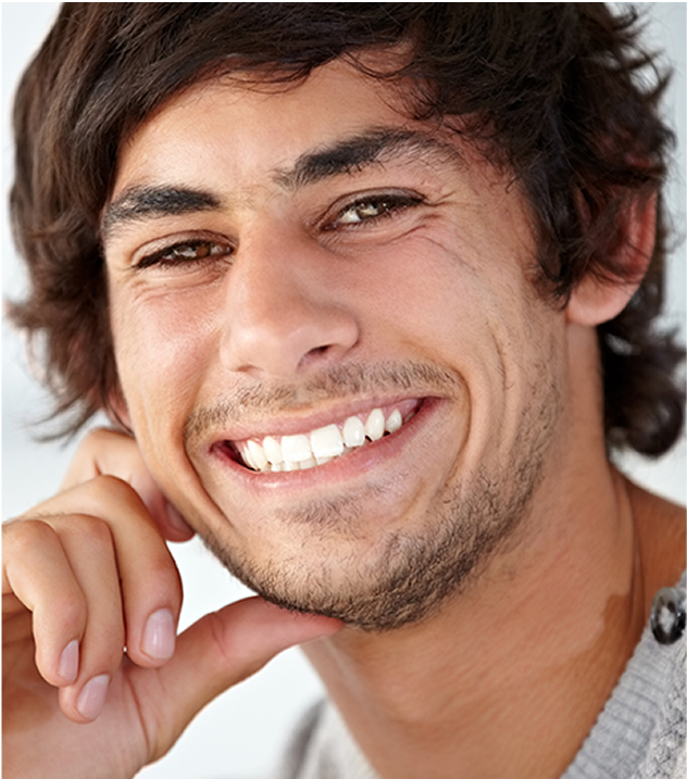 Guy smiling with his hand on his chin